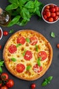 Fresh traditional Italian pizza Margarita or margharita with tomato sauce, mozzarella cheese and fresh green basil on top Royalty Free Stock Photo