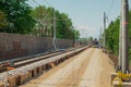 Fresh train track construction, creating lower gravel bed for new and modern tracks. Different tools around the contruction site, Royalty Free Stock Photo