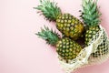 Fresh tree pineapple on pink background. Summer concept. Creative flat lay with copy space. Royalty Free Stock Photo