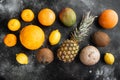 Fresh tropical fruit, on black dark stone table background, top view flat lay Royalty Free Stock Photo