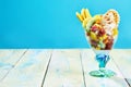 Fresh tropical fruit salad with whipped cream Royalty Free Stock Photo