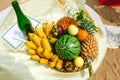 Fresh tropical Fruits on the beach at the basket. Assorted tropical fruits, bananas, ananas vs pineapple, watermelon