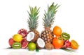Fresh Tropical Fruits. Pineapple, coconut, kiwi, orange, pomegranate, grapefruit. On a wooden background. Top view. Royalty Free Stock Photo
