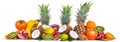 Fresh Tropical Fruits. Pineapple, coconut, kiwi, orange, pomegranate, grapefruit. On a wooden background.