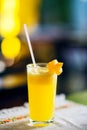 Fresh tropical mango juice in a glass decorated with a carambola slice. Royalty Free Stock Photo