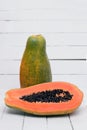 Fresh tropical papaya fruit isolated on a white background.