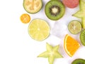 Top view of a ripe and tropical slices of fruits with cubes of ice isolated on a white background. Royalty Free Stock Photo