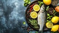 A fresh trout on a tray with lemons and herbs, ready for cooking Royalty Free Stock Photo