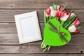 Fresh tulip flowers bouquet and photo frame Royalty Free Stock Photo