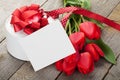 Fresh tulips, gift box and greeting card Royalty Free Stock Photo