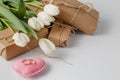 Fresh tulips and gift box over white background Royalty Free Stock Photo