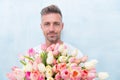 Fresh tulips. Giving her all best. Valentines day and anniversary. How to be romantic. Romantic gentleman. Man mature Royalty Free Stock Photo