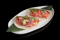 Fresh tuna fillet with avocado on pita bread in a white plate. Ceviche dish or seafood and fish tartare, close up