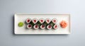 Fresh Tuna Maki Rolls with Wasabi and Pickled Ginger on White Plate Royalty Free Stock Photo