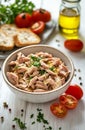 Fresh tuna salad with cherry tomatoes and olive oil on rustic table setting Royalty Free Stock Photo
