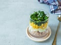 Fresh tuna salad with egg corn greens in a glass Cup on a concrete table. copy space Royalty Free Stock Photo