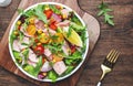 Fresh tuna vegetables salad with colorful cherry tomatoes, red onion, sweet corn, paprika, lettuce, radicchio and arugula. Rustic