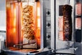 Fresh Turkish shawarma kebab, meat cooked on an electric skewer