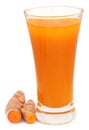 Fresh turmeric with extract in a glass