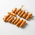 Fresh turmeric roots (Curcuma longa) are displayed on a white background. The roots are cylindrical, Royalty Free Stock Photo