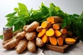 Fresh turmeric on a wooden board on the table