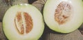 Fresh two half of cantaloupe melon for sale at fruit market in vintage color style Royalty Free Stock Photo