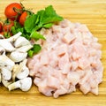 Fresh uncooked chicken meat breast pieces, ready to cook, with tomatoes greens and mushrooms Royalty Free Stock Photo