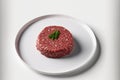 Fresh, uncooked ground beef is displayed on a white plate