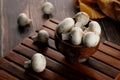 Fresh Uncooked Organic Button Mushrooms in a Wooden Bowl