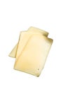 Fresh Uncooked Raclette Swiss cheese slices on marble board. High quality Isolate, white background.