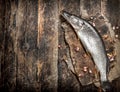 Fresh unprepared pike on a cutting board.