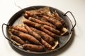 Unwashed carrots in a metal tray