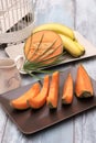 Fresh and various fruits isolated in a shabby chic background. melon and bananas. Vertical view from the top