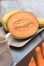 Fresh and various fruits isolated in a shabby chic background. melon and bananas. Vertical view from the top