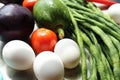 Fresh various raw organic vegetables with white eggs display for healthy and diet background.