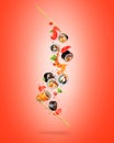 Fresh various sushi rolls with ingredients in the air on a red background