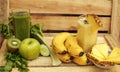 Fresh vegan green and yellow smoothies