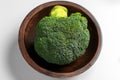 Fresh vegetable broccoli in kitchen wooden bowl. Green texture of crucifers plant