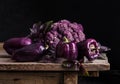 Fresh vegetable. Dark purple peppers, cauliflower, leaves of basil Royalty Free Stock Photo