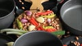 Fresh vegetable ingredients with kitchen utensils ready to cook.