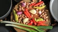 Fresh vegetable ingredients with kitchen utensils ready to cook.