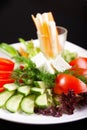 Fresh vegetable salad on a black background