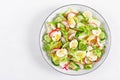 Fresh vegetable salad with cucumber, radish, lettuce and boiled eggs. Helathy food. Top view Royalty Free Stock Photo