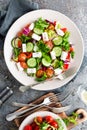 Fresh vegetable salad with feta cheese, fresh lettuce, cherry tomatoes, red onion and pepper Royalty Free Stock Photo