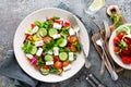 Fresh vegetable salad with feta cheese, fresh lettuce, cherry tomatoes, red onion and pepper Royalty Free Stock Photo