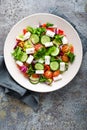 Fresh vegetable salad with feta cheese, fresh lettuce, cherry tomatoes, red onion and pepper Royalty Free Stock Photo