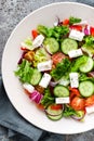 Fresh vegetable salad with feta cheese, fresh lettuce, cherry tomatoes, red onion and pepper Royalty Free Stock Photo