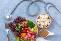 Fresh vegetable salad and healthy food for sport equipment bandage MD medical doctor physicial stethoscope for women diet slimming Royalty Free Stock Photo