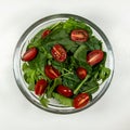 Fresh vegetable salad plate. Step 2 - cherry tomatoes. Royalty Free Stock Photo