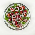 Fresh vegetable salad plate. Step 4 - onion. Royalty Free Stock Photo